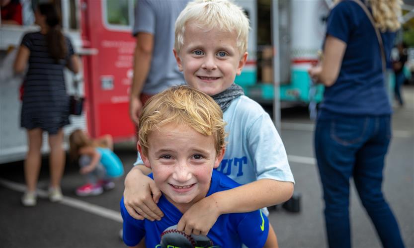 Two boys smile